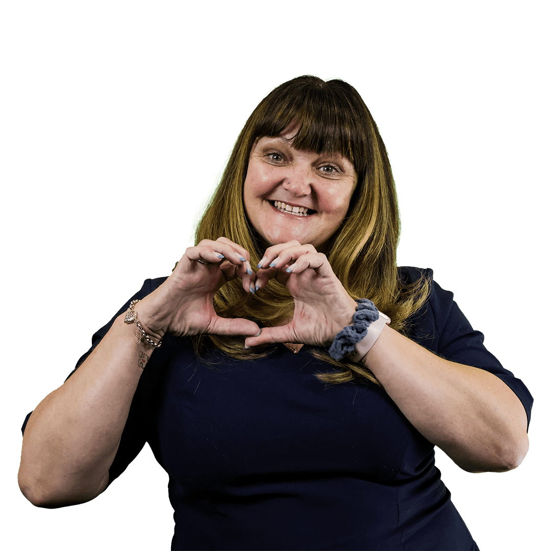 Smiling woman in navy outfit forming a heart shape with her hands, representing the caring and personalized service ethos of Kimberlie & Co Cleaning.